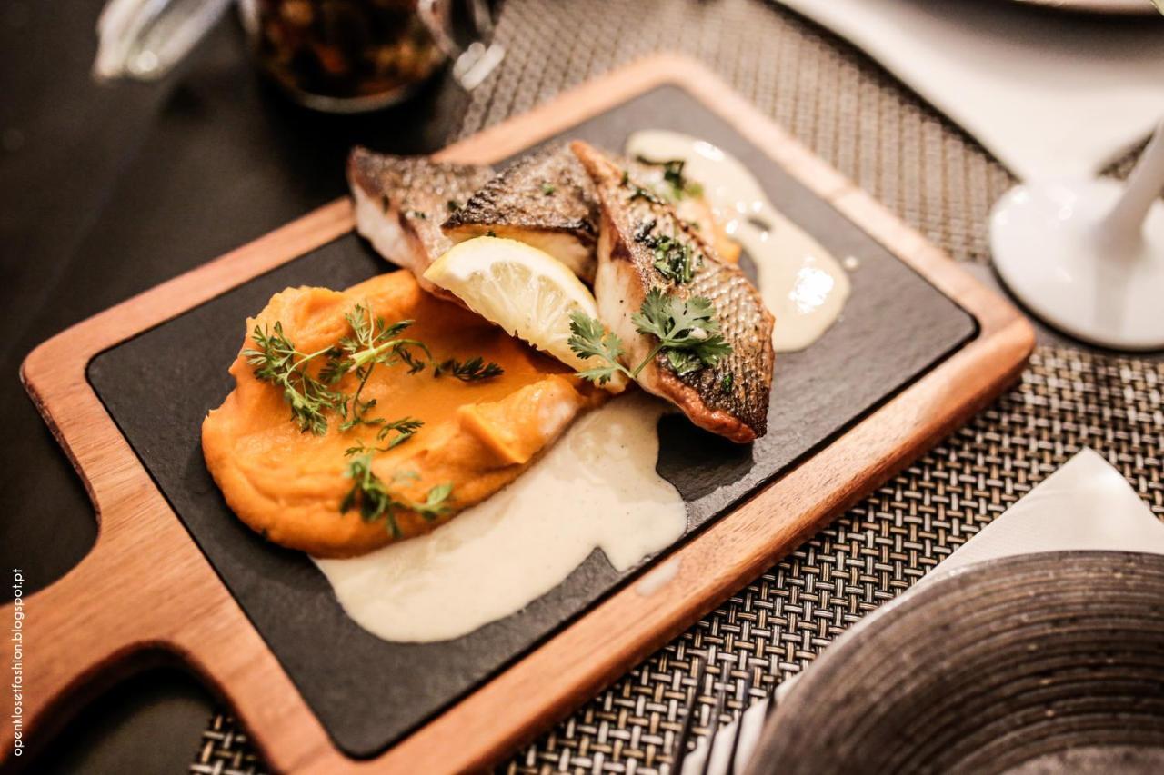 Hotel Quinta das Lagrimas - Small Luxury Hotels Coimbra Esterno foto A dish of grilled grouper with mashed sweet potato and a white wine sauce